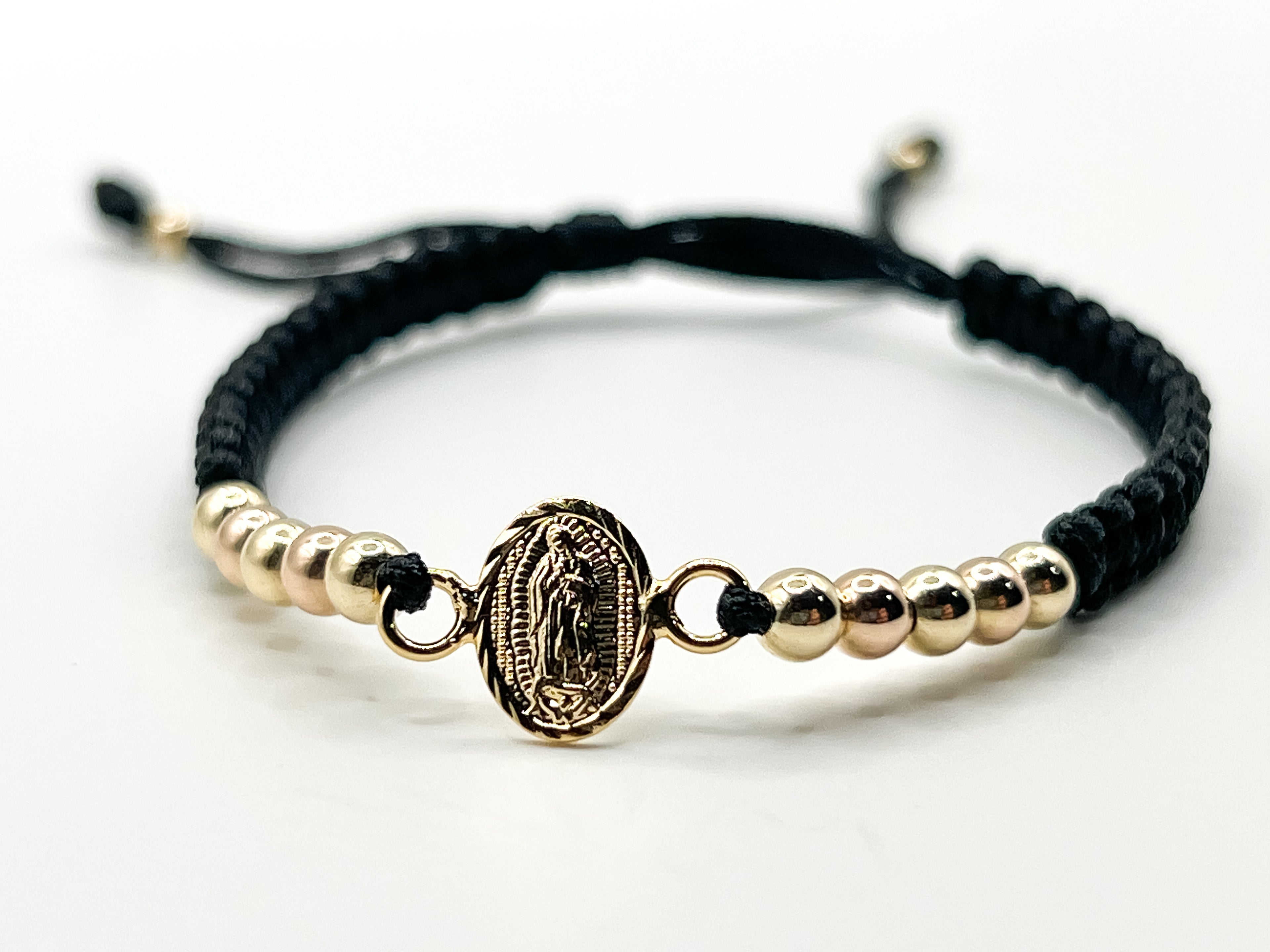 Pulsera Tejida Negra con Dije Virgen y Balines 3mm
